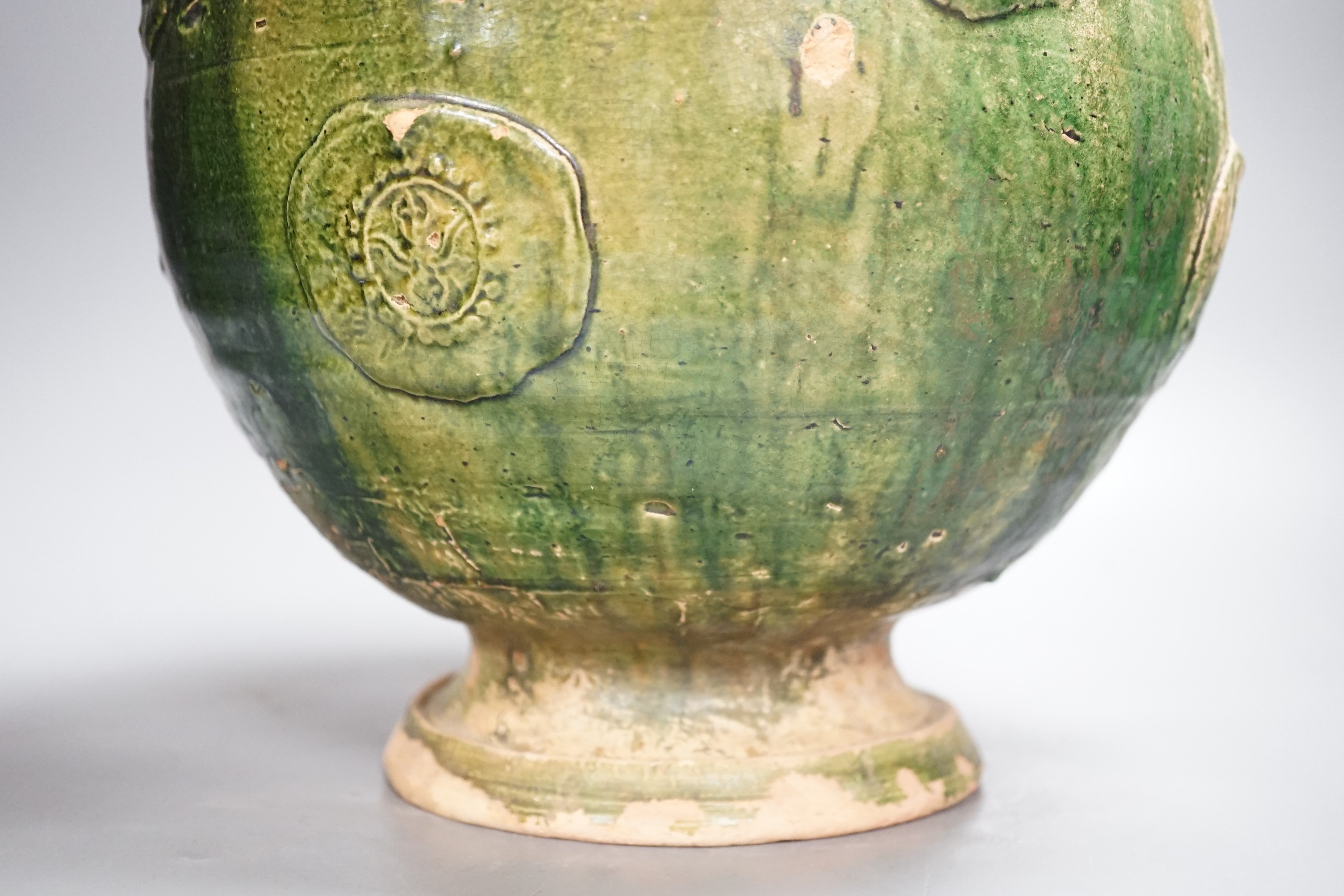 A large Chinese green glazed jar and cover, Liao dynasty, 35cm high